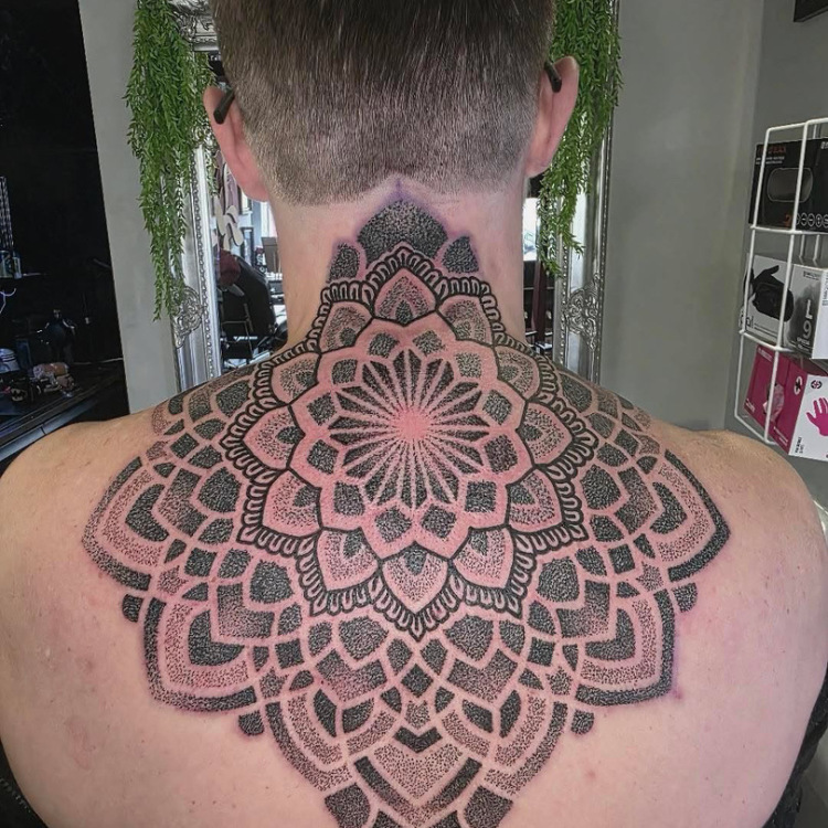 Neck tattoo by broken puppet tattoo