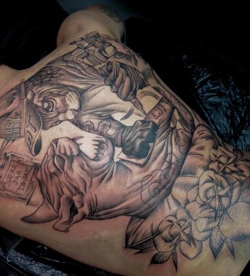 Cats tattoo black and grey done by Rick in Worthing West Sussex