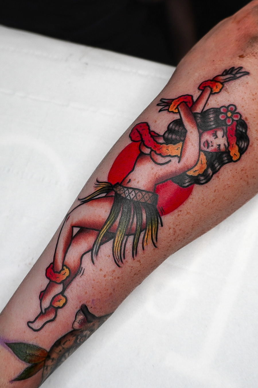 Traditional pin up girl tattoo by Rick at Broken puppet tattoo in Worthing uk