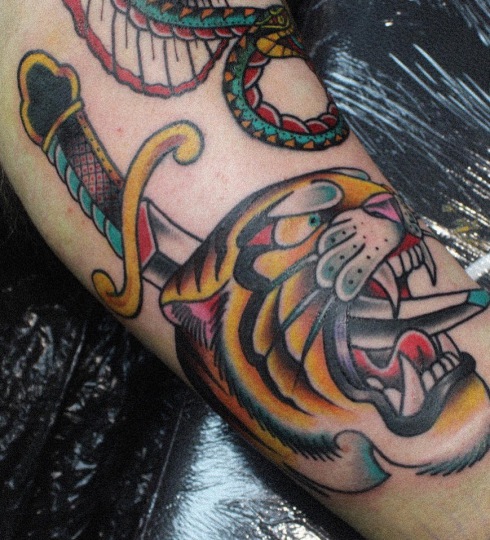Traditional tiger head tattoo done at broken puppet tattoo in Worthing