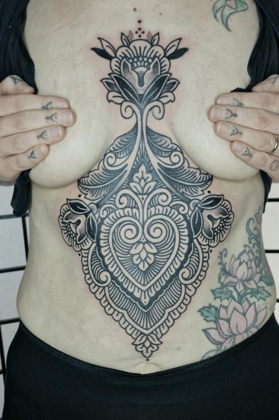 Sternum ornamental tattoo done in Worthing uk